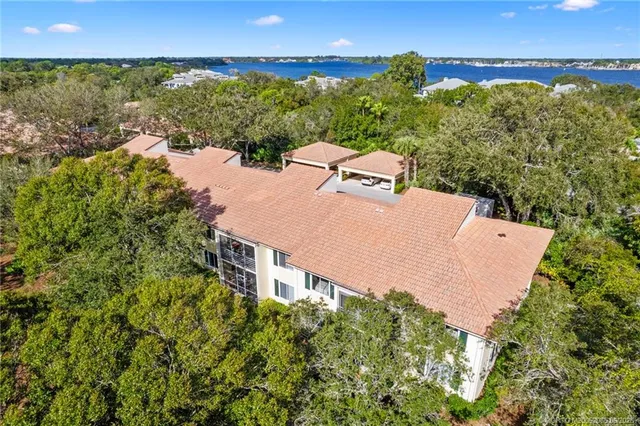 an aerial view of a house with a lake view