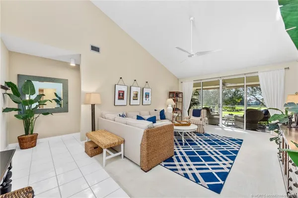 a living room with furniture and a rug