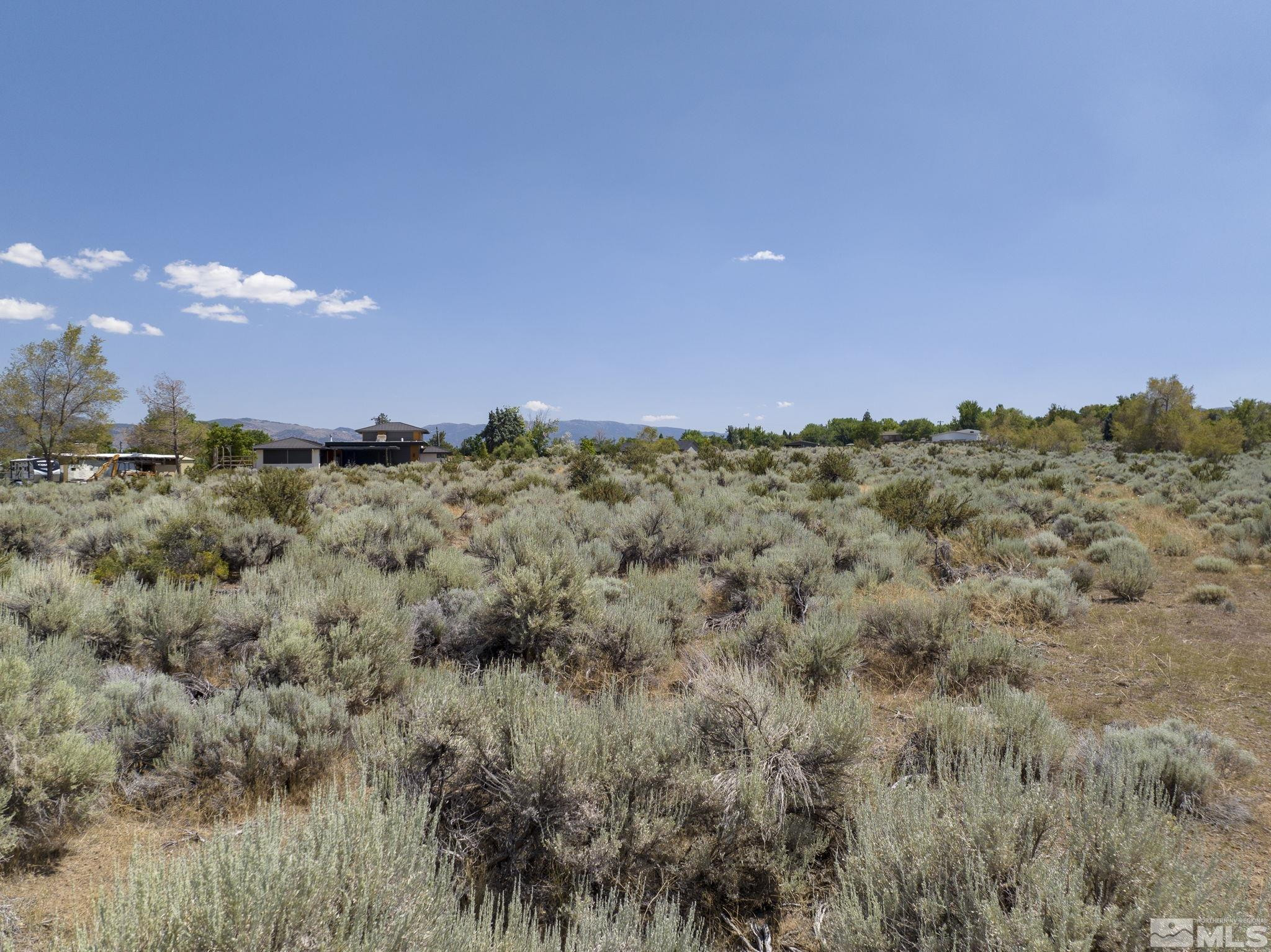 24 Glenhaven Drive, Unit 17 Reno, NV 89511 - Photo 5 of 14 a view of a big yard with a mountain in the background