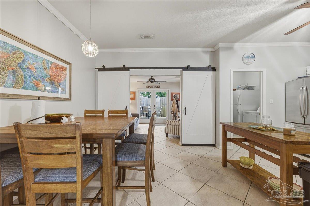 26063 Canal Road, Unit 3F Orange Beach, AL 36561 - Photo 25 of 72 a dining room with furniture and window