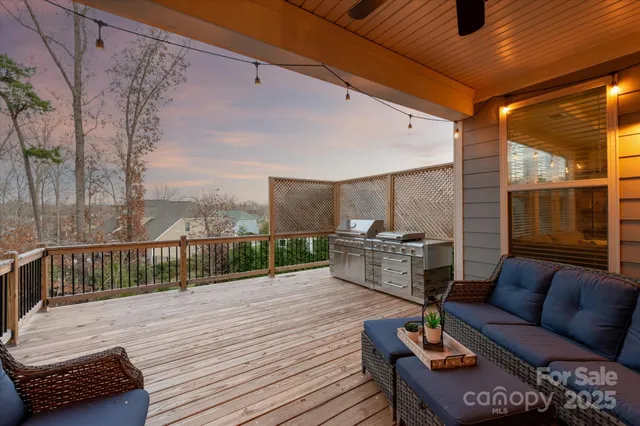 a balcony with furniture and wooden floor