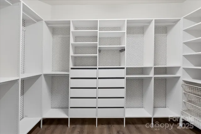 a view of an empty walk in closet