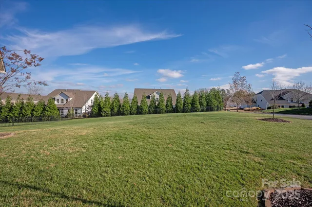 a view of a green field with clear sky