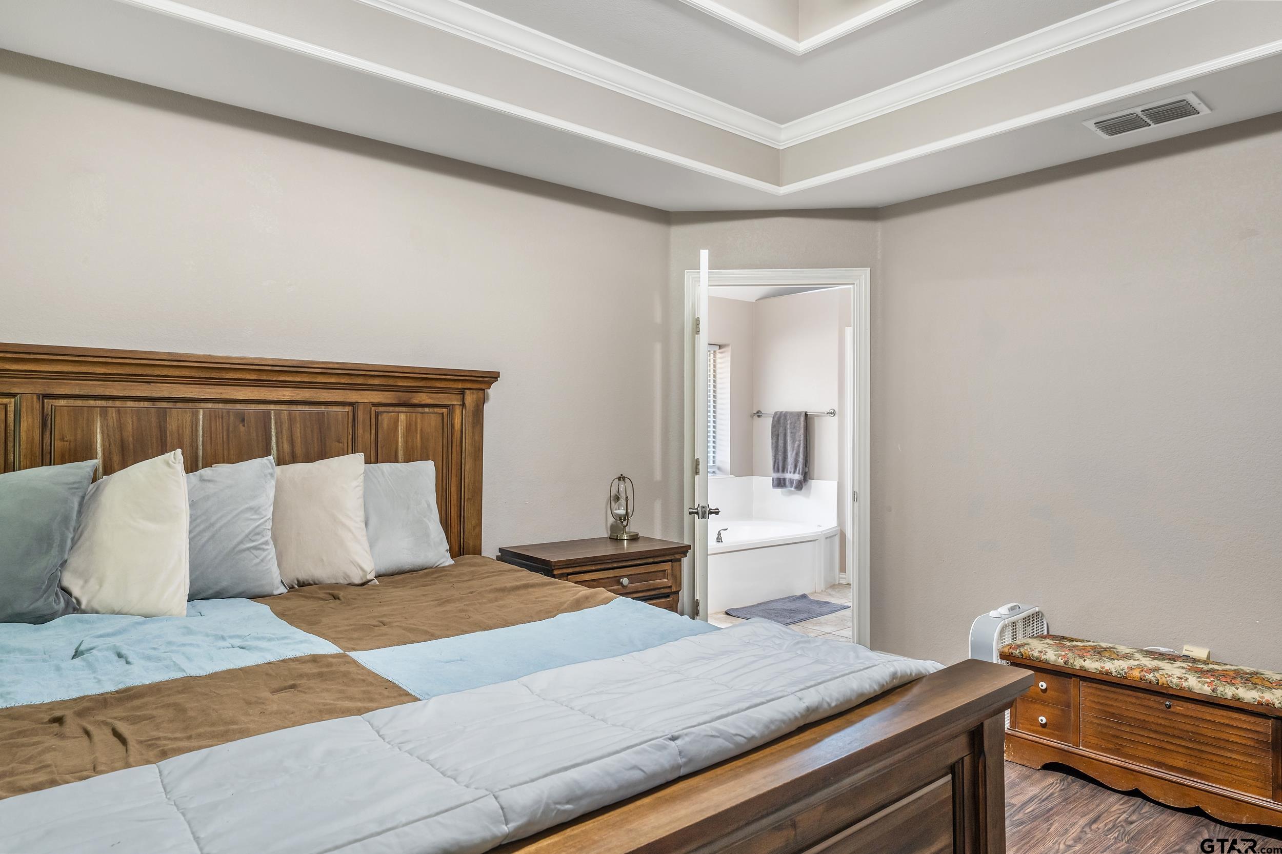 19499 Sara Lane Flint, TX 75762 - Photo 15 of 31 a bedroom with a bed and cabinet