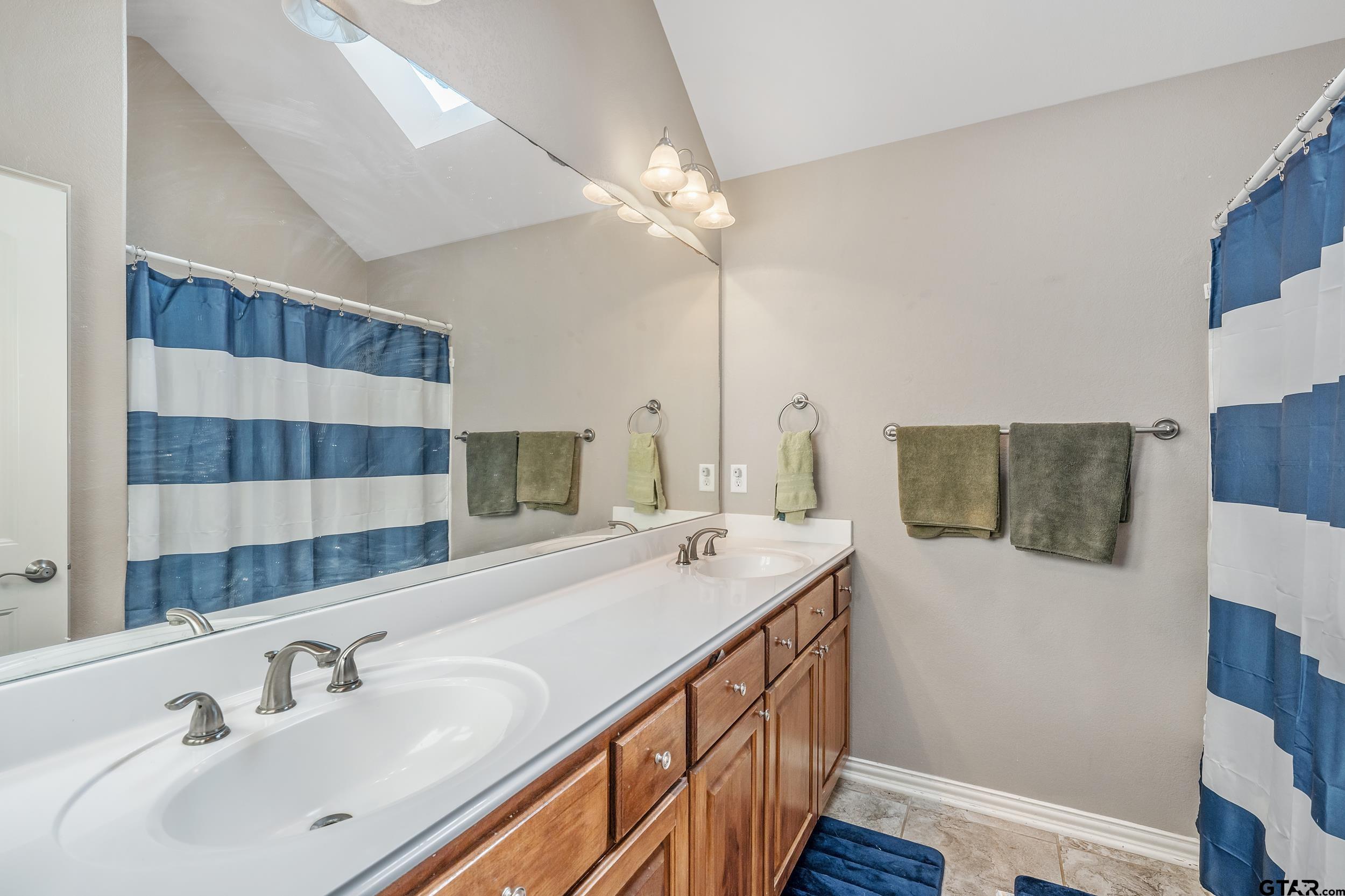 19499 Sara Lane Flint, TX 75762 - Photo 21 of 31 a bathroom with a sink and a mirror