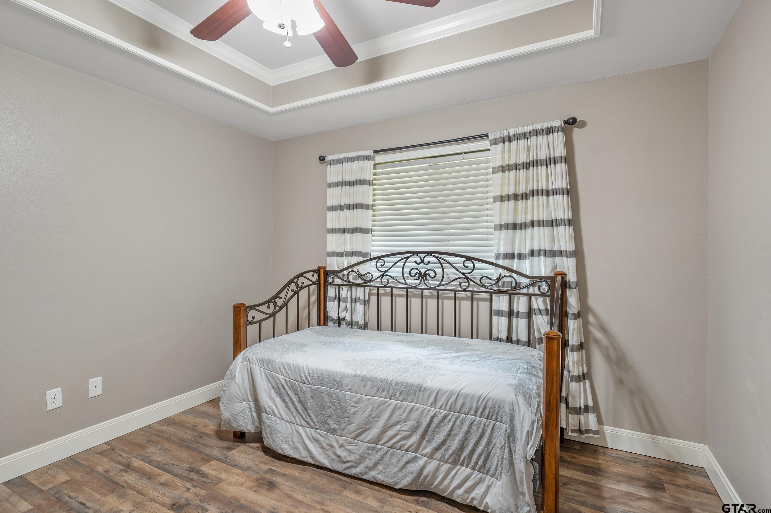 19499 Sara Lane Flint, TX 75762 - Photo 22 of 31 a bedroom with a bed and a window