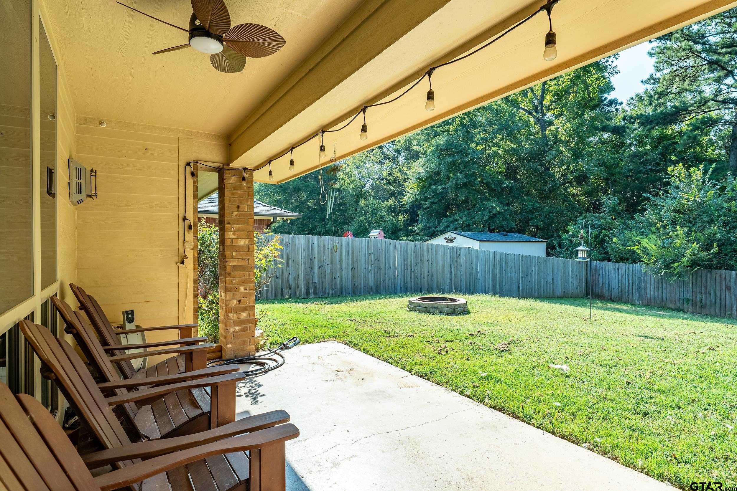 19499 Sara Lane Flint, TX 75762 - Photo 26 of 31 a view of a backyard with wooden fence