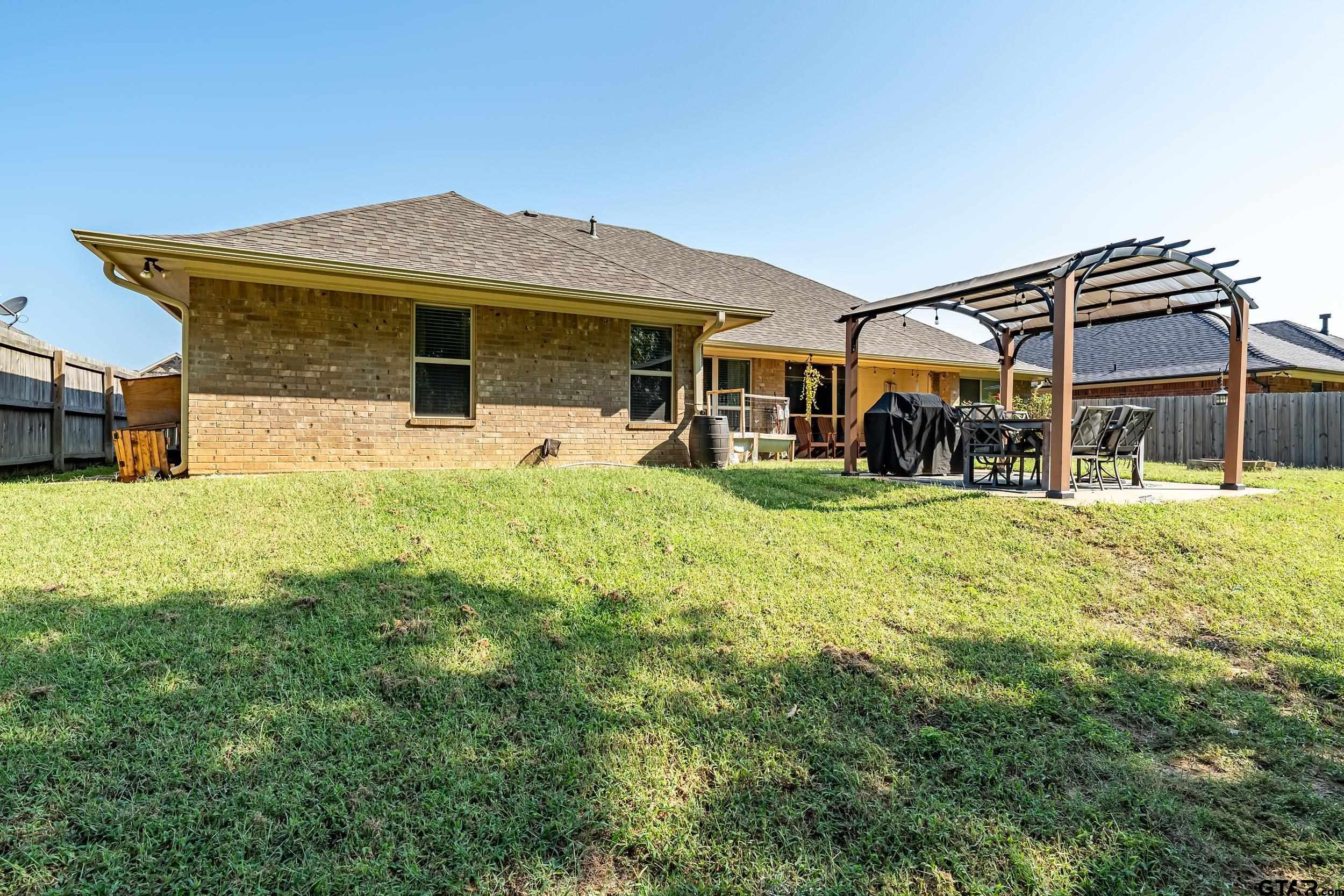 19499 Sara Lane Flint, TX 75762 - Photo 29 of 31 a view of a house with a big yard and sitting area