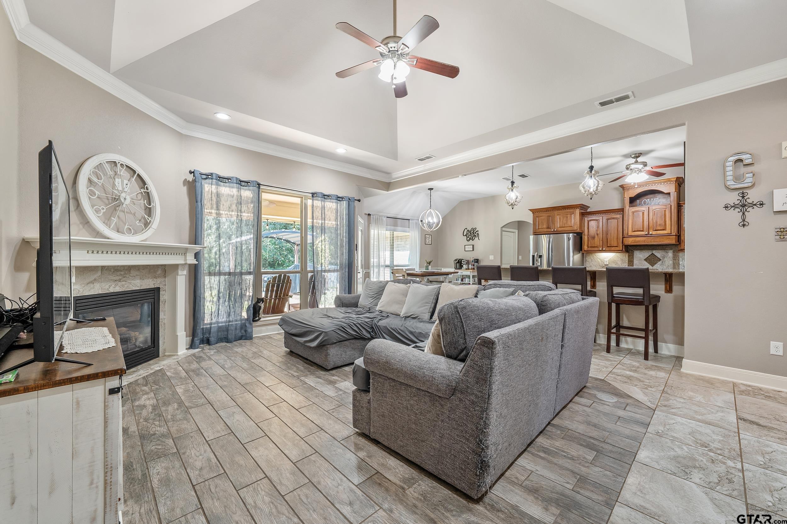 19499 Sara Lane Flint, TX 75762 - Photo 5 of 31 a living room with furniture a fireplace and a large window