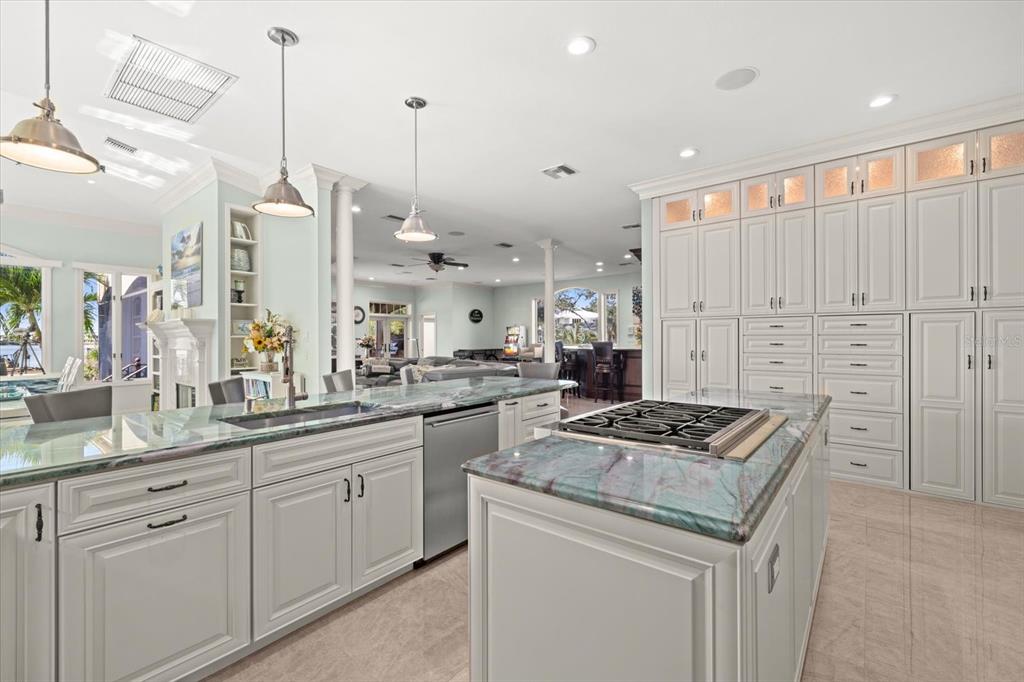 2115 Lychee Lane Nokomis, FL 34275 - Photo 11 of 85 a kitchen with stainless steel appliances granite countertop a sink a stove and a refrigerator