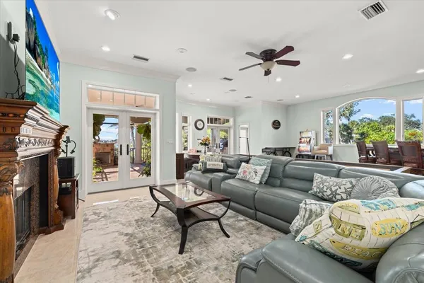 a living room with furniture and a large window