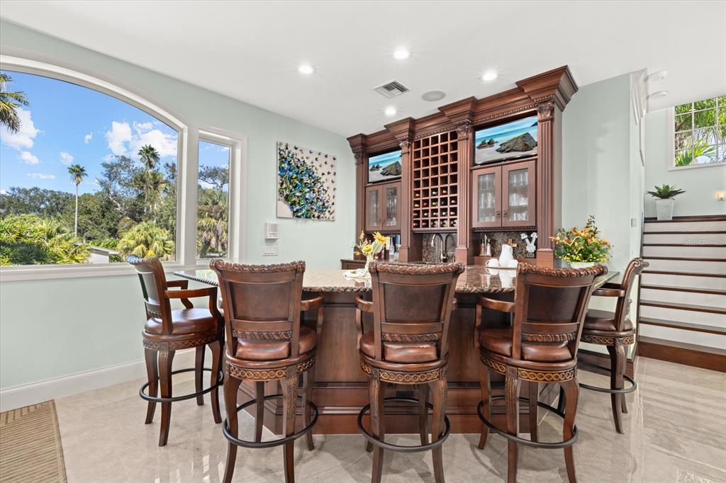 2115 Lychee Lane Nokomis, FL 34275 - Photo 18 of 85 a view of a dining room with furniture window and outside view