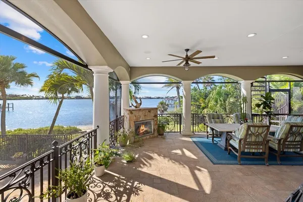 a kitchen with stainless steel appliances granite countertop a sink dishwasher and white cabinets with wooden floor