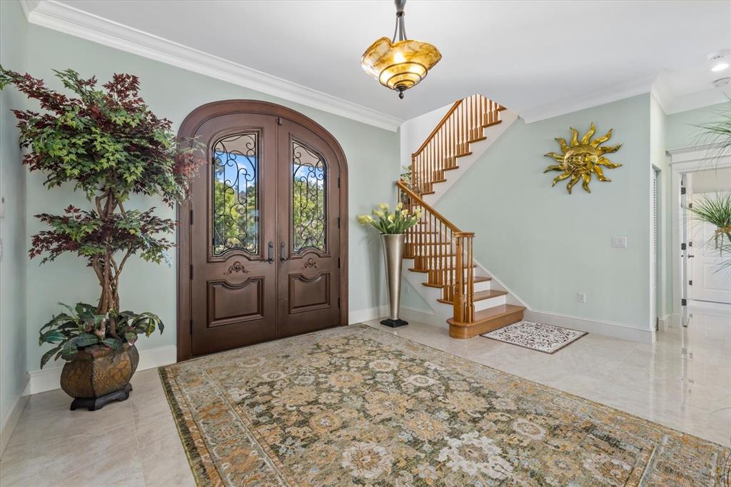 2115 Lychee Lane Nokomis, FL 34275 - Photo 30 of 85 a view of an entryway with a potted plant