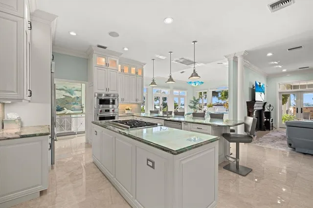 a view of a livingroom with furniture and a ceiling fan