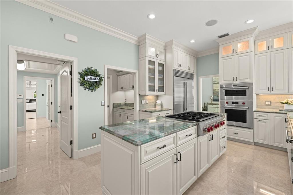 2115 Lychee Lane Nokomis, FL 34275 - Photo 39 of 85 a kitchen with stainless steel appliances granite countertop a stove a sink and a refrigerator