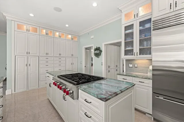a view of a balcony with wooden floor & fence