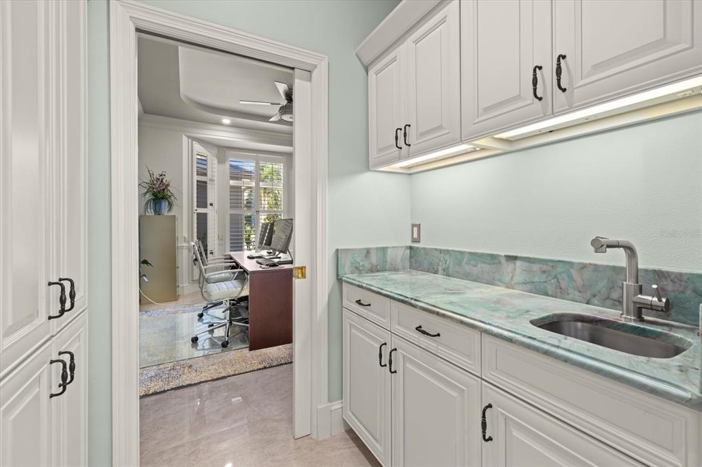 2115 Lychee Lane Nokomis, FL 34275 - Photo 45 of 85 a bathroom with a sink and mirror