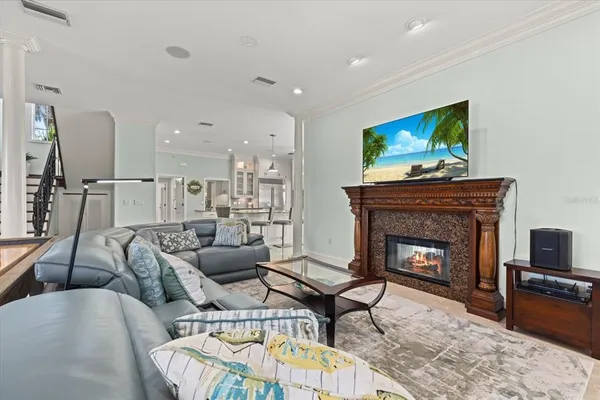 an aerial view of residential houses with outdoor space and trees