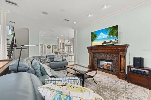 an aerial view of residential houses with outdoor space and trees