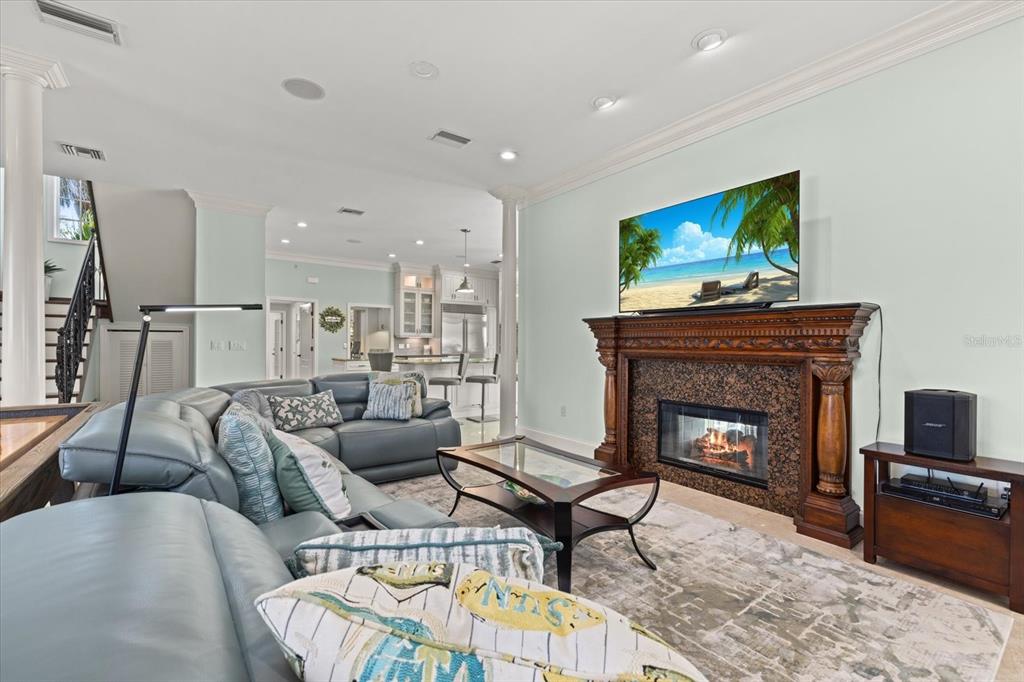 2115 Lychee Lane Nokomis, FL 34275 - Photo 48 of 85 a living room with furniture and a fireplace