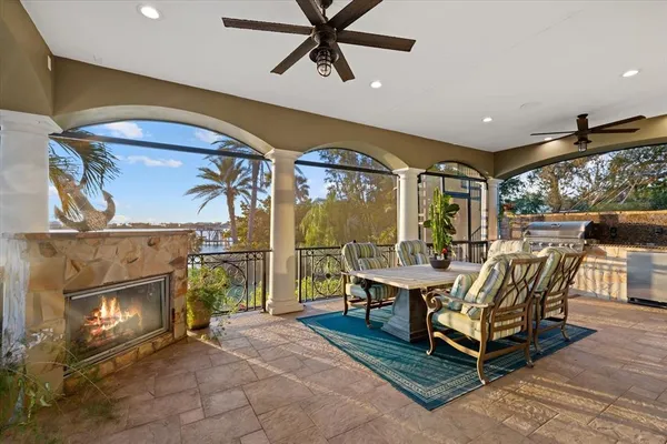 a kitchen with stainless steel appliances granite countertop a sink a stove and a refrigerator