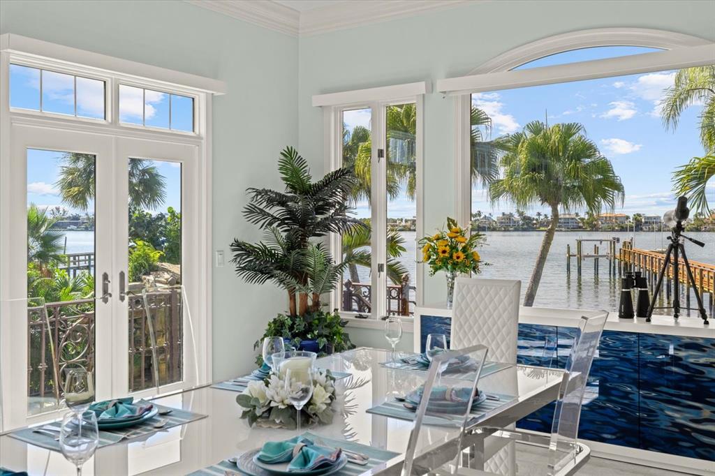 2115 Lychee Lane Nokomis, FL 34275 - Photo 7 of 85 a view of a dining room with furniture window and wooden floor