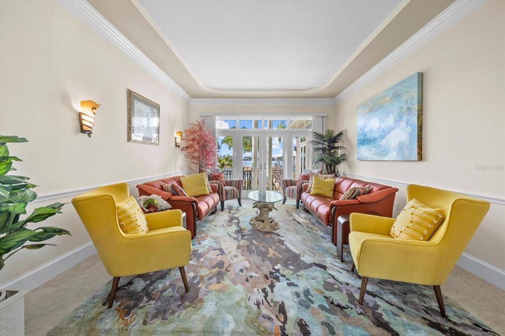 2115 Lychee Lane Nokomis, FL 34275 - Photo 9 of 85 a living room with furniture and a potted plant