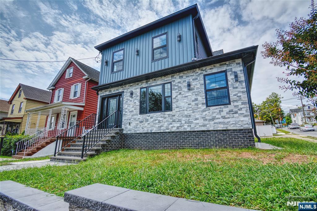 72 Hille Place Ridgefield Park, NJ 07660 - Photo 1 of 39 a front view of a house with a garden