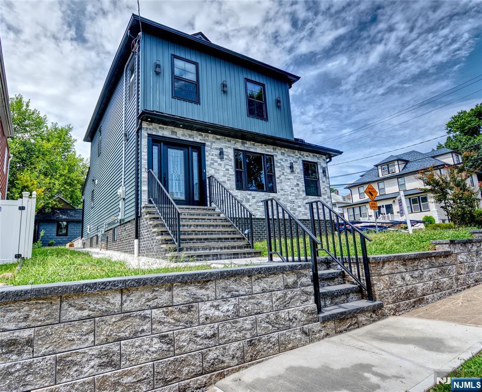 72 Hille Place Ridgefield Park, NJ 07660 - Photo 2 of 39 a front view of a house with garden