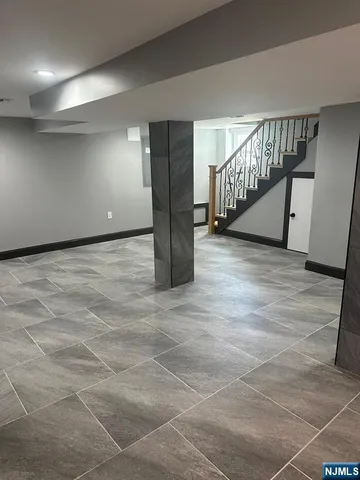 a view of an empty room with stairs