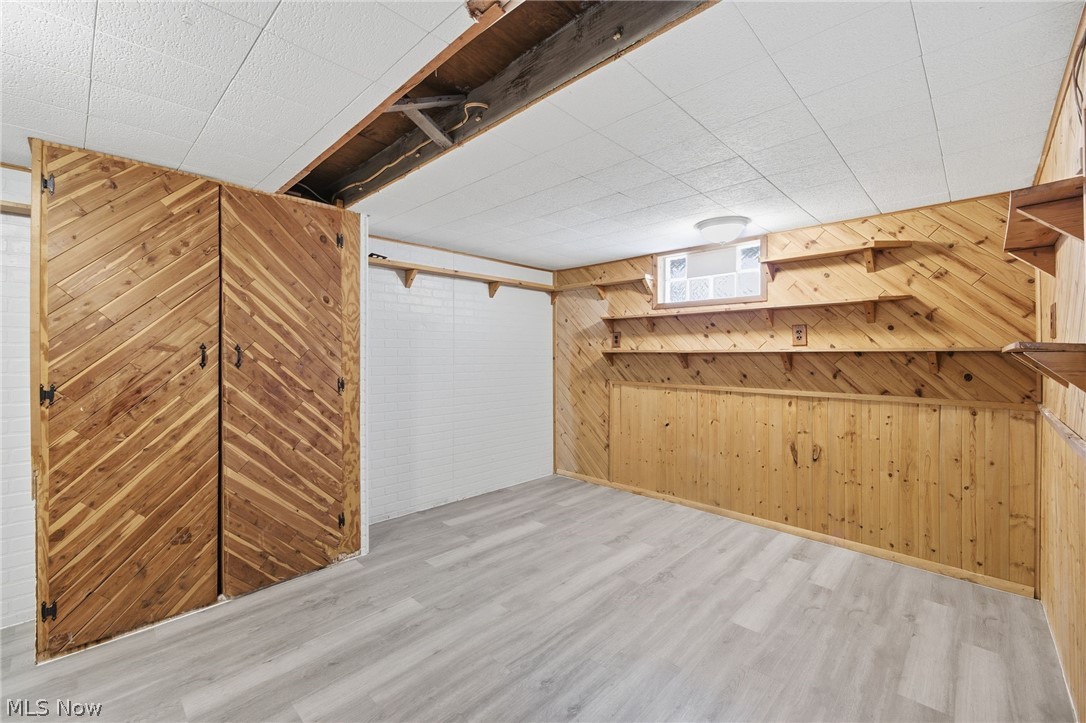 20705 Hansen Road Maple Heights, OH 44137 - Photo 20 of 24 Bonus room with wood walls and wood finished floors