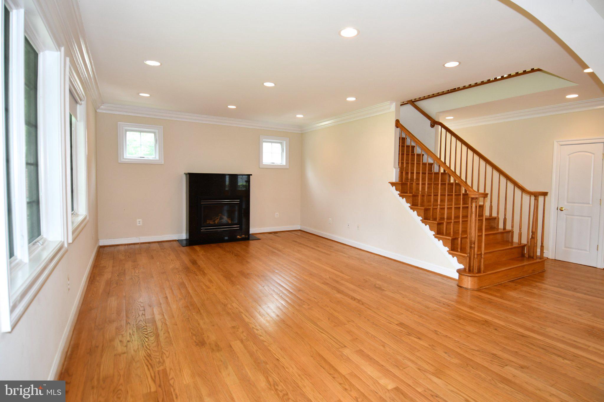 1924 Leonard Road Falls Church, VA 22043 - Photo 12 of 61 Spacious living area with elegant staircase.