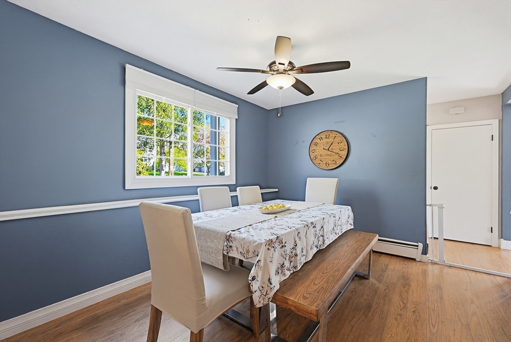 18 Anchorage Road Franklin, MA 02038 - Photo 14 of 42 a view of a dining room with a table and chairs