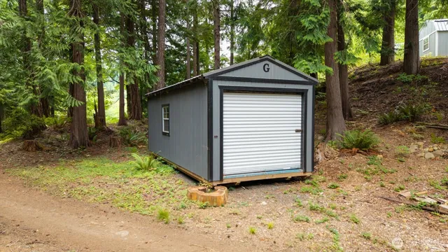 a small barn with a small yard