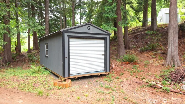 a house with trees in the background
