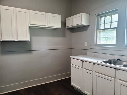 356 West Cypress Street Kankakee, IL 60901 - Photo 5 of 10 a kitchen with stainless steel appliances white cabinets and a sink