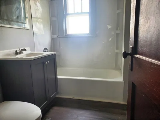 a bathroom with a sink and a bathtub