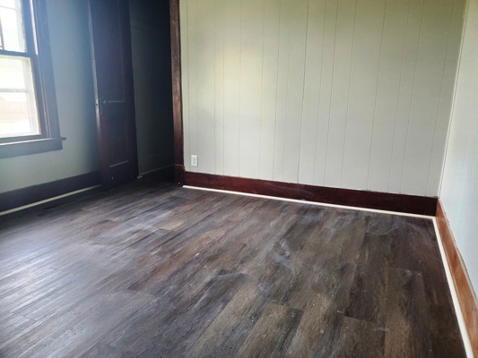 356 West Cypress Street Kankakee, IL 60901 - Photo 9 of 10 an empty room with wooden floor and windows