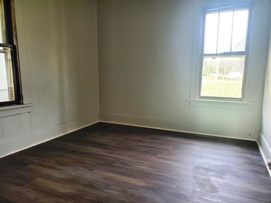 356 West Cypress Street Kankakee, IL 60901 - Photo 10 of 10 an empty room with wooden floor and windows