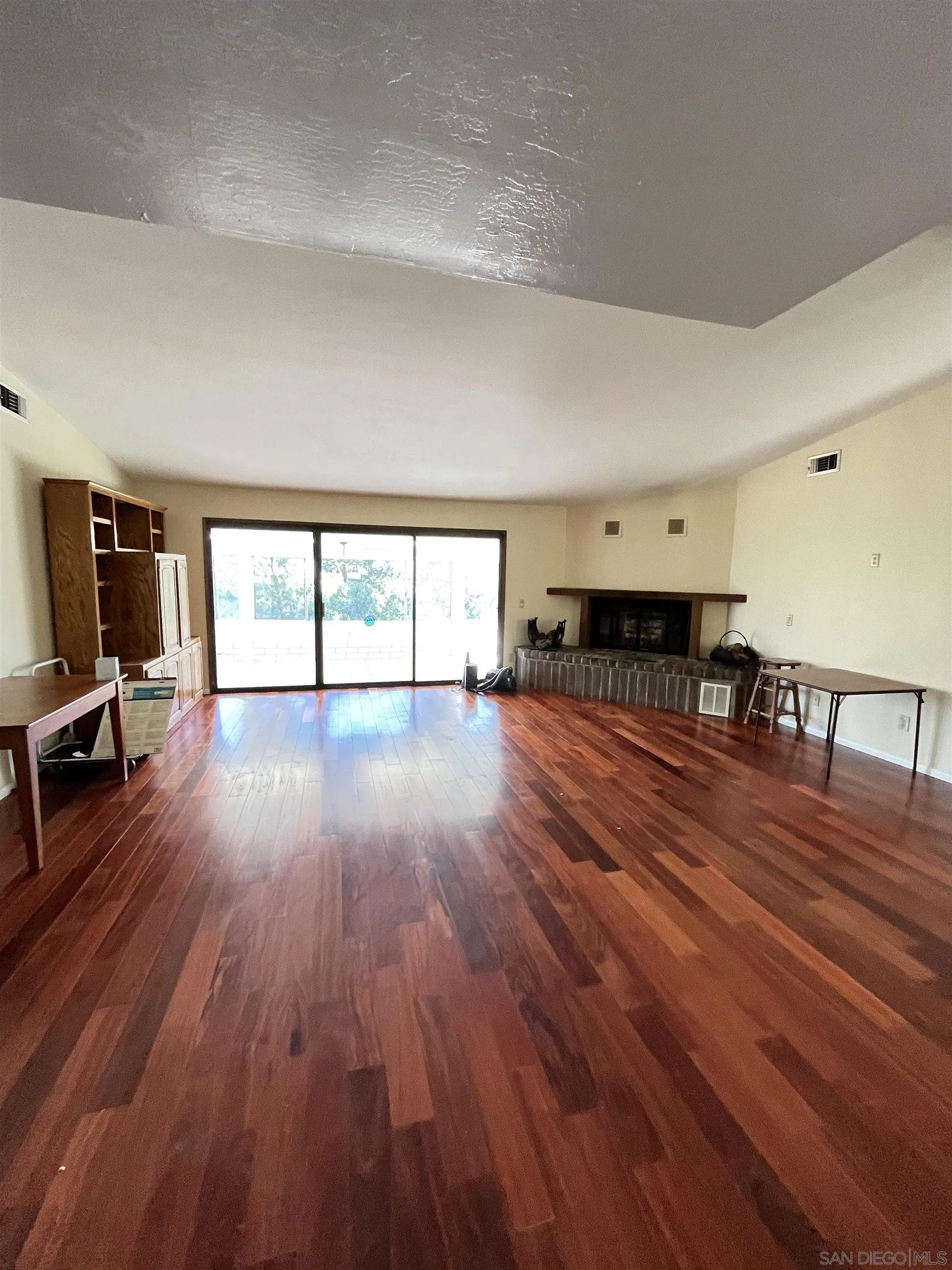 721 Rainbow Crest Road Fallbrook, CA 92028 - Photo 8 of 42 a living room with furniture and a wooden floor