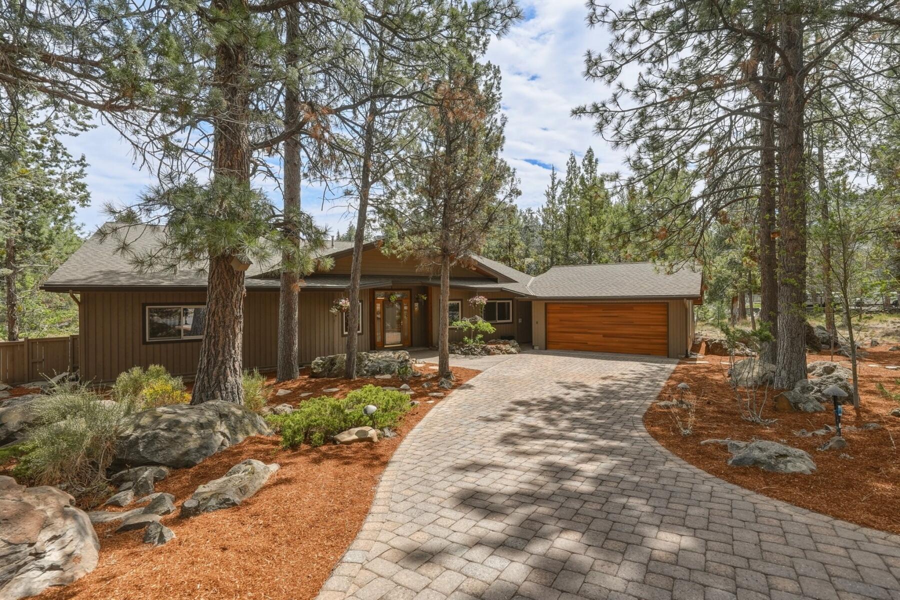 637 Northwest Silver Buckle Road Bend, OR 97703 - Photo 3 of 68 a front view of a house with a yard and tree s