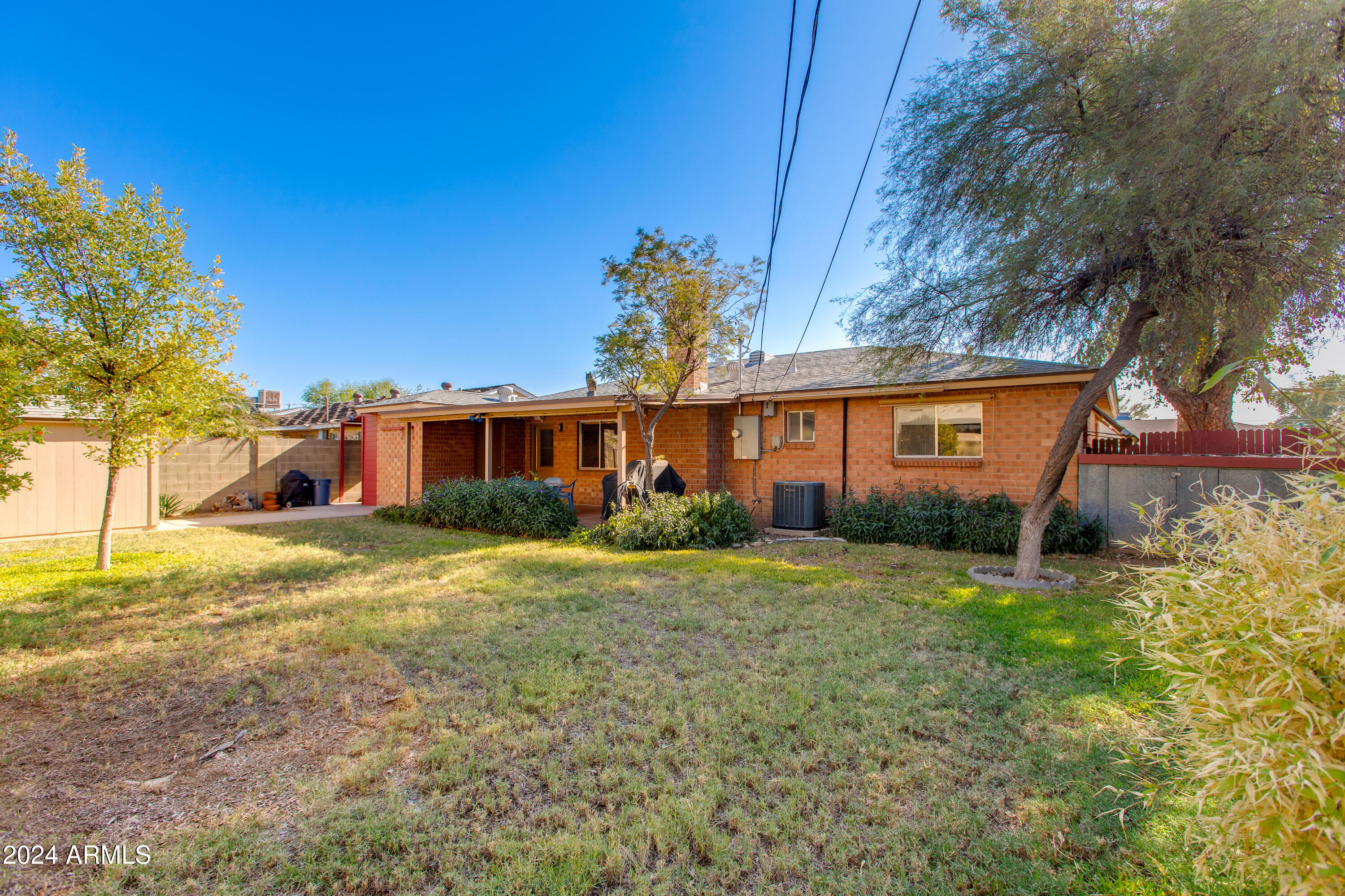 2752 West Lawrence Road Phoenix, AZ 85017 - Photo 22 of 23 a front view of a house with a yard