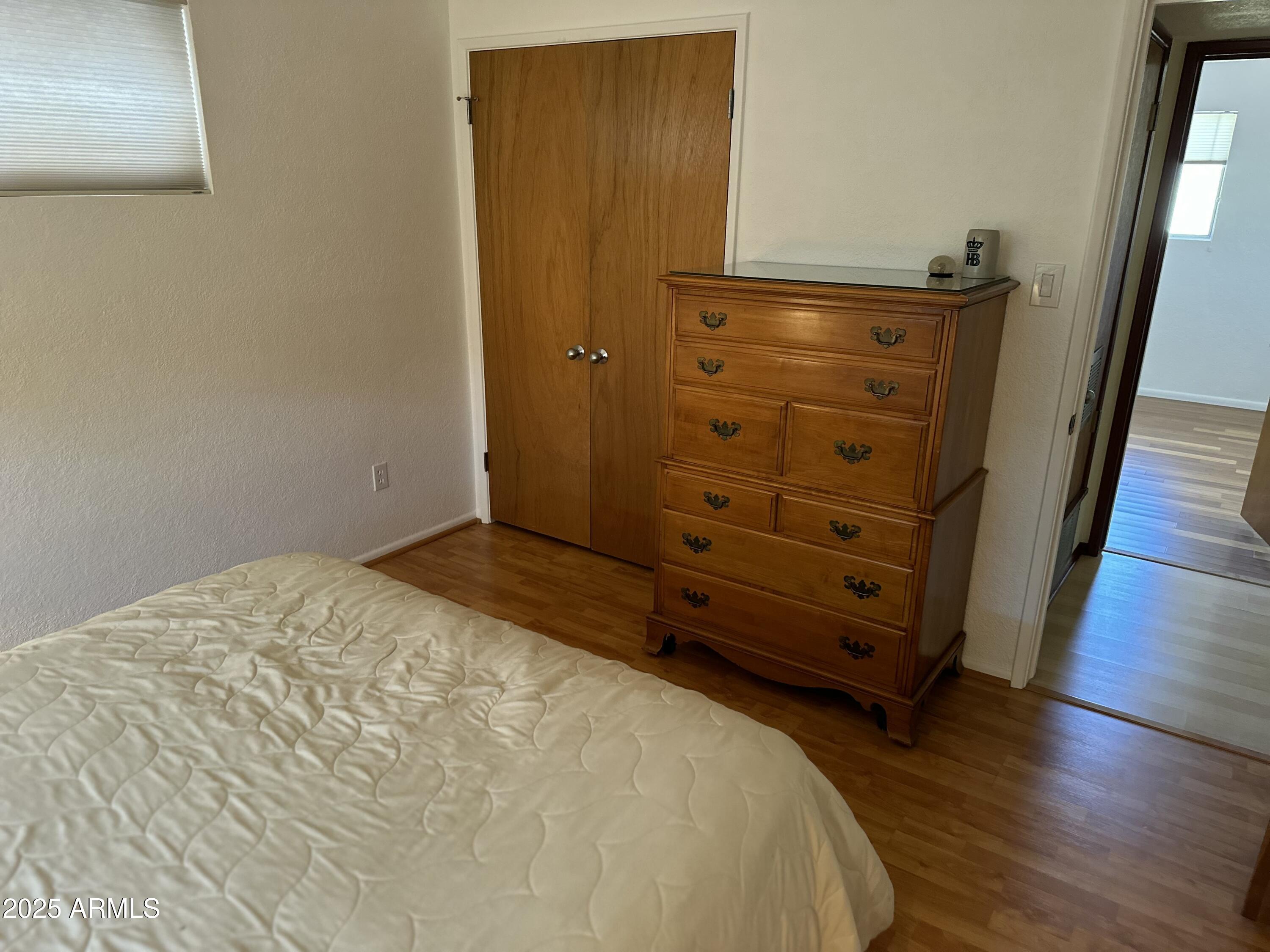 2752 West Lawrence Road Phoenix, AZ 85017 - Photo 10 of 23 wooden floor in a closet