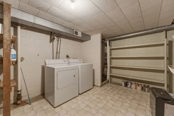 a utility room with cabinets