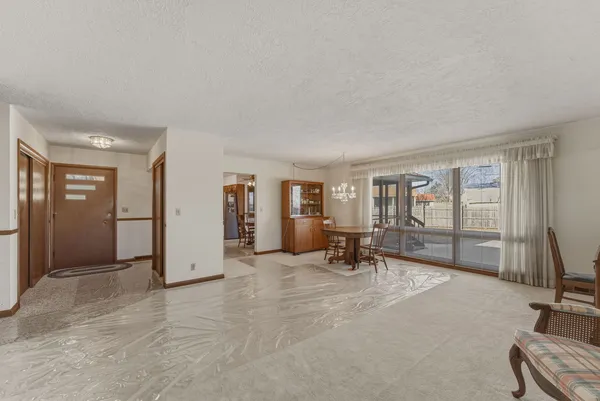 a view of a livingroom with couch and a large window