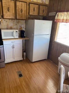 3003 Hualapai Mountain Road, Unit 29 Kingman, AZ 86401 - Photo 12 of 30 a kitchen with a refrigerator sink and cabinets