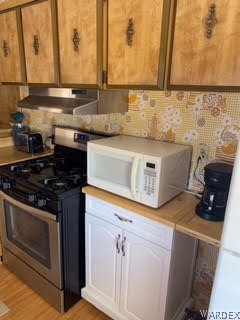 3003 Hualapai Mountain Road, Unit 29 Kingman, AZ 86401 - Photo 13 of 30 a kitchen with a stove and a sink