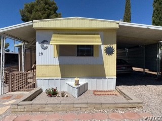 3003 Hualapai Mountain Road, Unit 29 Kingman, AZ 86401 - Photo 2 of 30 a front view of a house with a yard