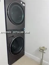 a kitchen with a refrigerator and window